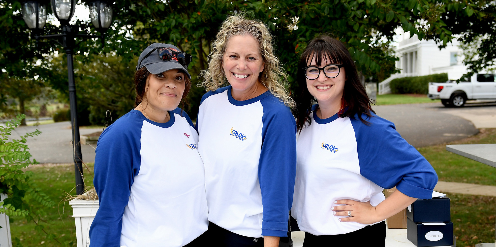 SPARK Director, President, and Admin wearing SPARK shirts at 2025 Golf Classic